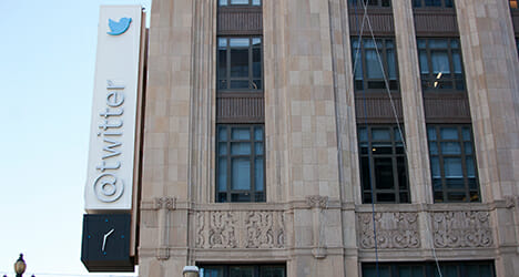An office building with a twitter logo on the side