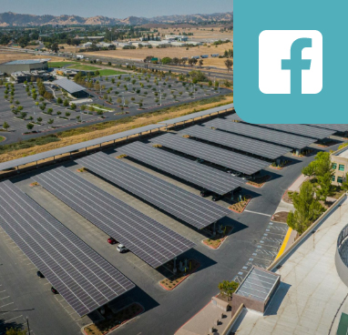 Solar panels from above with facebook icon overlaid