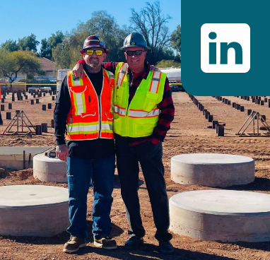 Two construction employees on site with linked in icon overlaid