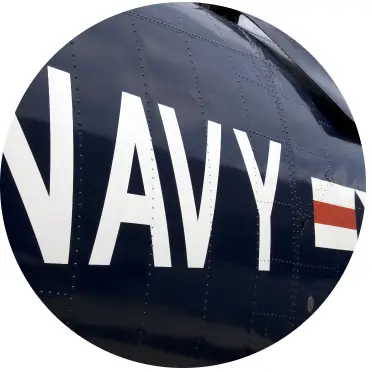 navy insignia painted on the side of a vehicle