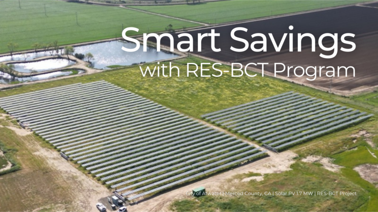 Aerial view of a solar photovoltaic (PV) installation in a rural area surrounded by fields and water features. The title "Smart Savings with RES-BCT Program" is prominently displayed, with a subtitle reading "City of Atwater | Merced County, CA | Solar PV 1.7 MW | RES-BCT Project." The image highlights clean energy infrastructure and the environmental benefits of renewable energy projects.