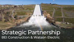 Aerial view of Oroville Dam spillway releasing water into the river below, representing BEI Construction’s strategic partnership with Watson Electric to expand utility and power-infrastructure expertise in California.