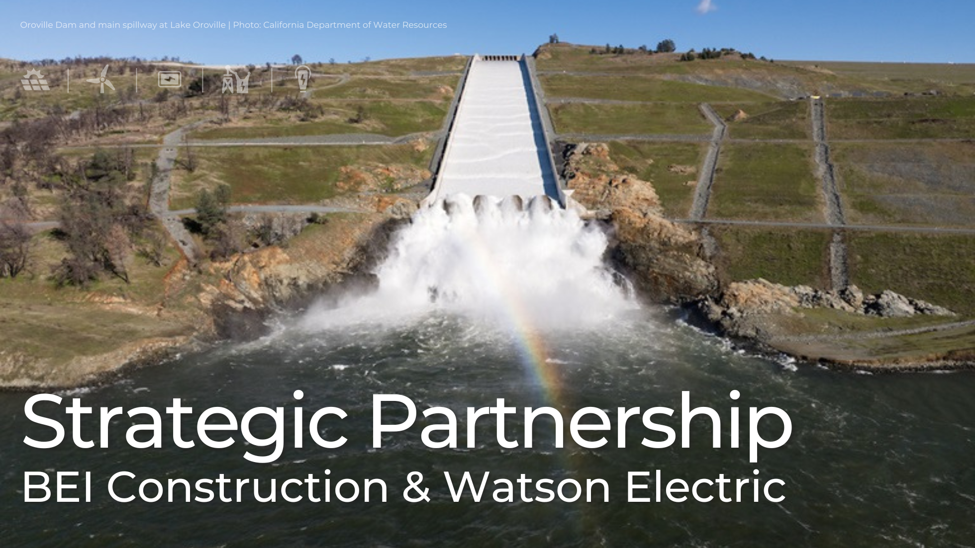 Aerial view of Oroville Dam spillway releasing water into the river below, representing BEI Construction’s strategic partnership with Watson Electric to expand utility and power-infrastructure expertise in California.